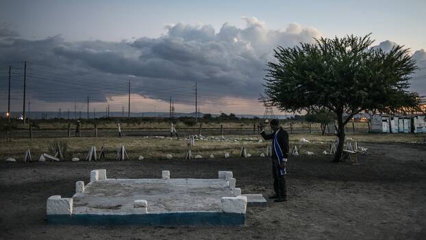 2014: A Pastor outside the church near the cattle-kraal at the Nkaneng/Marikana shack settlement where 17 mineworkers were shot dead by South African police during a wildcat strike in August 2012.