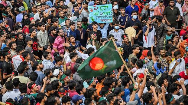 Anti-government protestors celebrate the resignation of Bangladeshi Prime Minister Sheikh Hasina in Shahbag near Dhaka University.